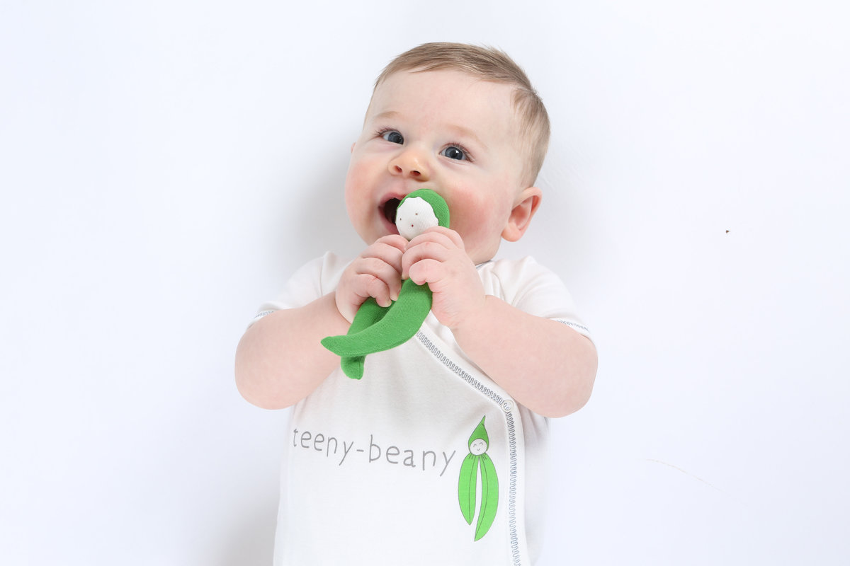 Organic white cotton short sleeve side snap baby body with teent beany slogan on front